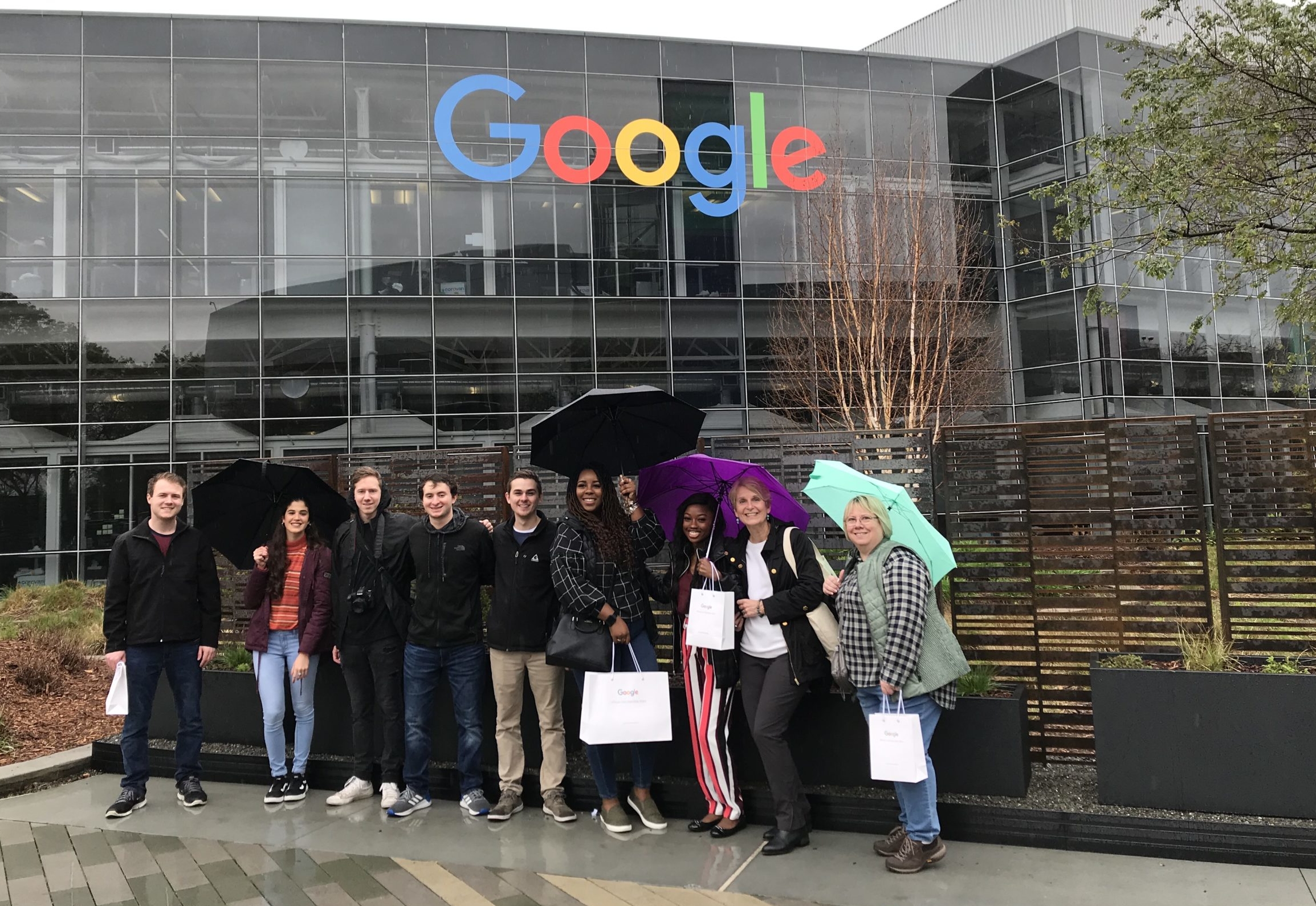 Students standing in front of Google