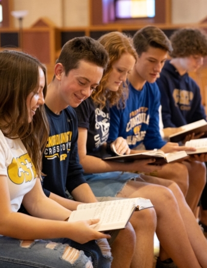 CSP Students reading church music in the chapel